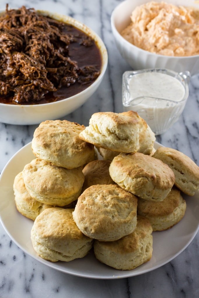 White BBQ Brisket Sandwiches | www.oliviascuisine.com | Eat like a Southerner with these delicious sandwiches made with pulled brisket, white BBQ sauce, pimento cheese in homemade biscuits!