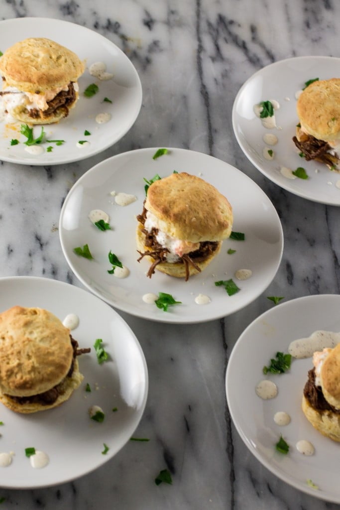 White BBQ Brisket Sandwiches | www.oliviascuisine.com | Eat like a Southerner with these delicious sandwiches made with pulled brisket, white BBQ sauce, pimento cheese in homemade biscuits!