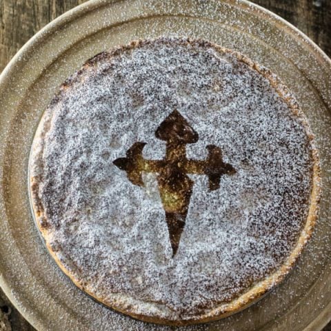 Torta de Santiago (Spanish Almond Pie) | www.oliviascuisine.com | Torta de Santiago (in Galician) or Tarta de Santiago (in Spanish) is a popular almond pie served in Santiago de Compostela. It is usually marked with the cross of the Order of Santiago.