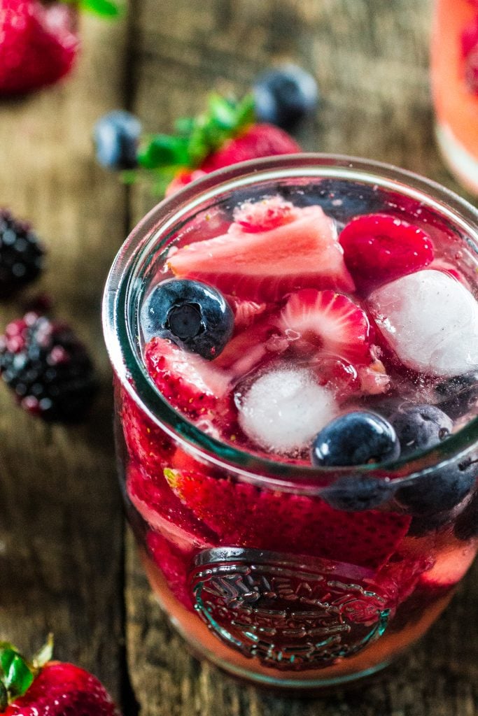Summer Berry Sangria | www.oliviascuisine.com | A delicious summer sangria made with Moscato, strawberries, raspberries, blackberries and blueberries! #MiddleSister #DropsofWisdom #Sp