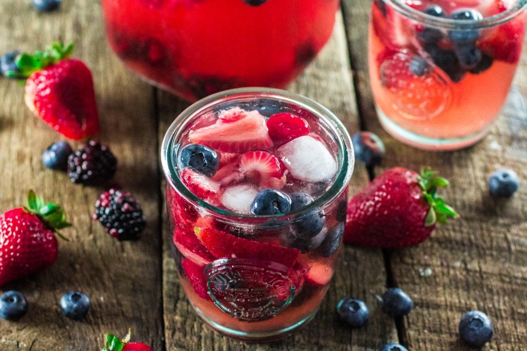 Summer Berry Sangria | www.oliviascuisine.com | A delicious summer sangria made with Moscato, strawberries, raspberries, blackberries and blueberries! #MiddleSister #DropsofWisdom #Sp