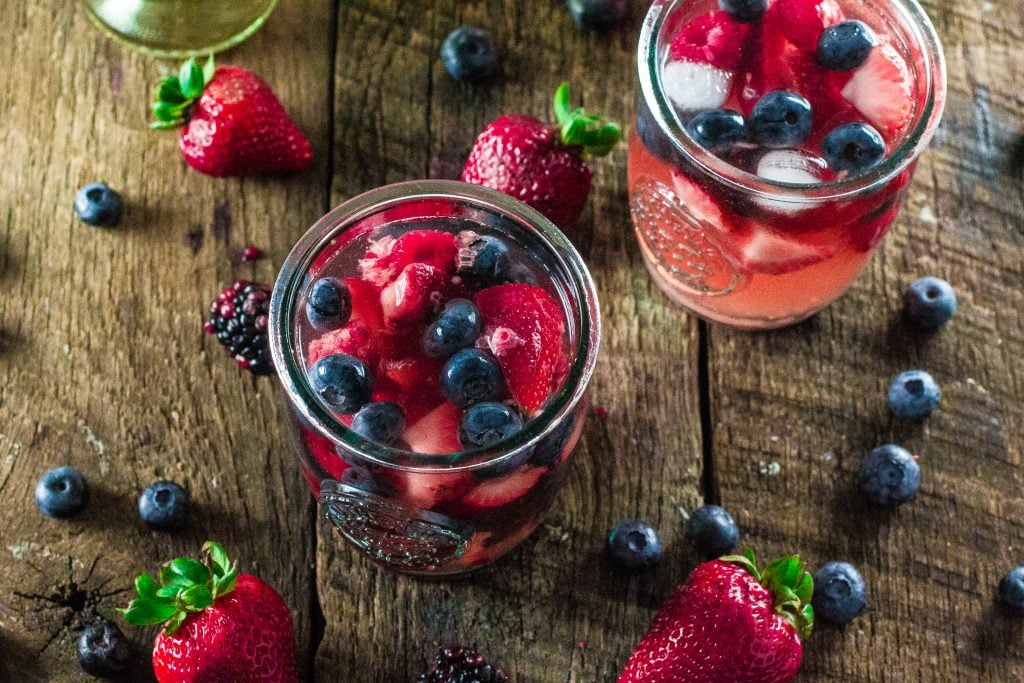 Summer Berry Sangria | www.oliviascuisine.com | A delicious summer sangria made with Moscato, strawberries, raspberries, blackberries and blueberries! #MiddleSister #DropsofWisdom #Sp