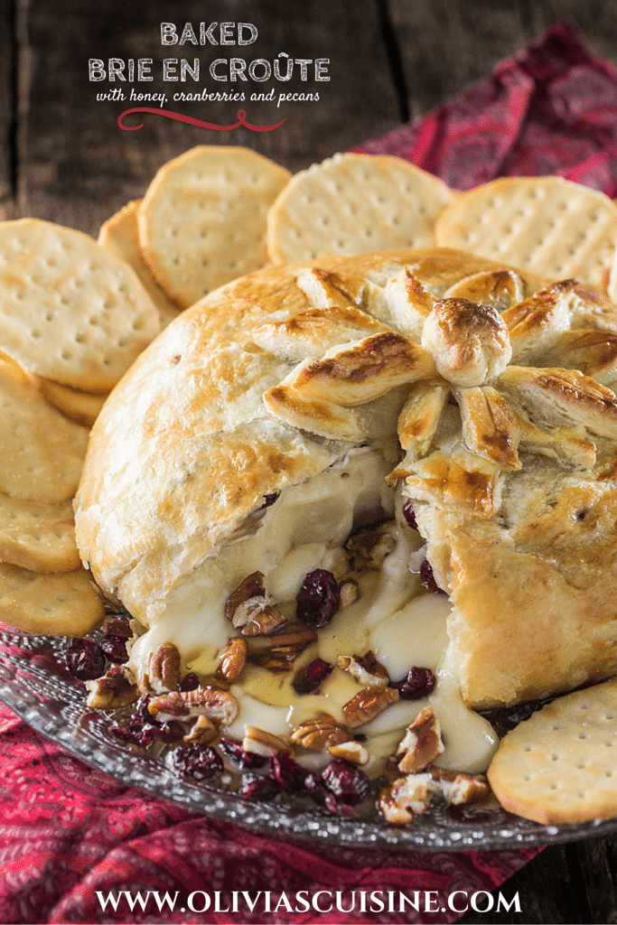Baked Brie en Croute | www.oliviascuisine.com | A delicious brie cheese covered in puff pastry and filled with honey, cranberries and pecans. Perfect as a Thanksgiving or Christmas appetizer!