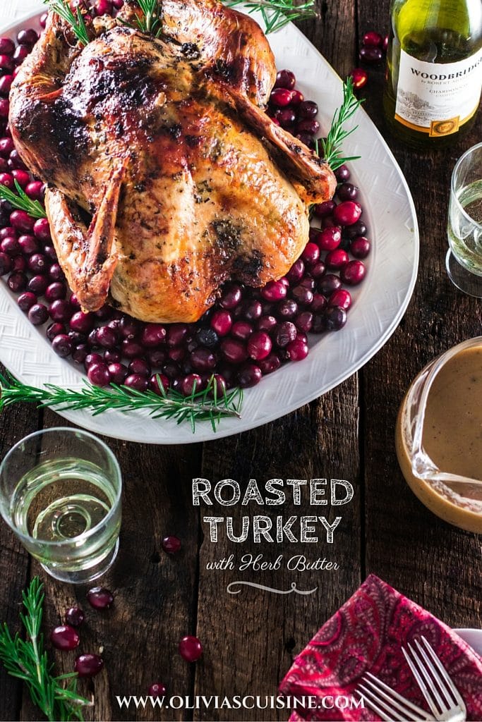 Roasted Turkey with Herb Butter | www.oliviascuisine.com | Looking for a good turkey recipe for Thanksgiving or Christmas? Look no further! This turkey is roasted with a parsley, lemon and garlic butter and covered in bacon (during roasting time) for amazing flavor and juiciness! 