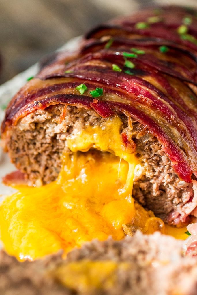 Bacon Wrapped Cheese Stuffed Meatloaf | www.oliviascuisine.com | Forget tough, dry meatloaves! This Bacon Wrapped Cheese Stuffed Meatloaf is not only moist but SO FLAVORFUL! Comfort food at its best! #NaturallyCheesy #AD