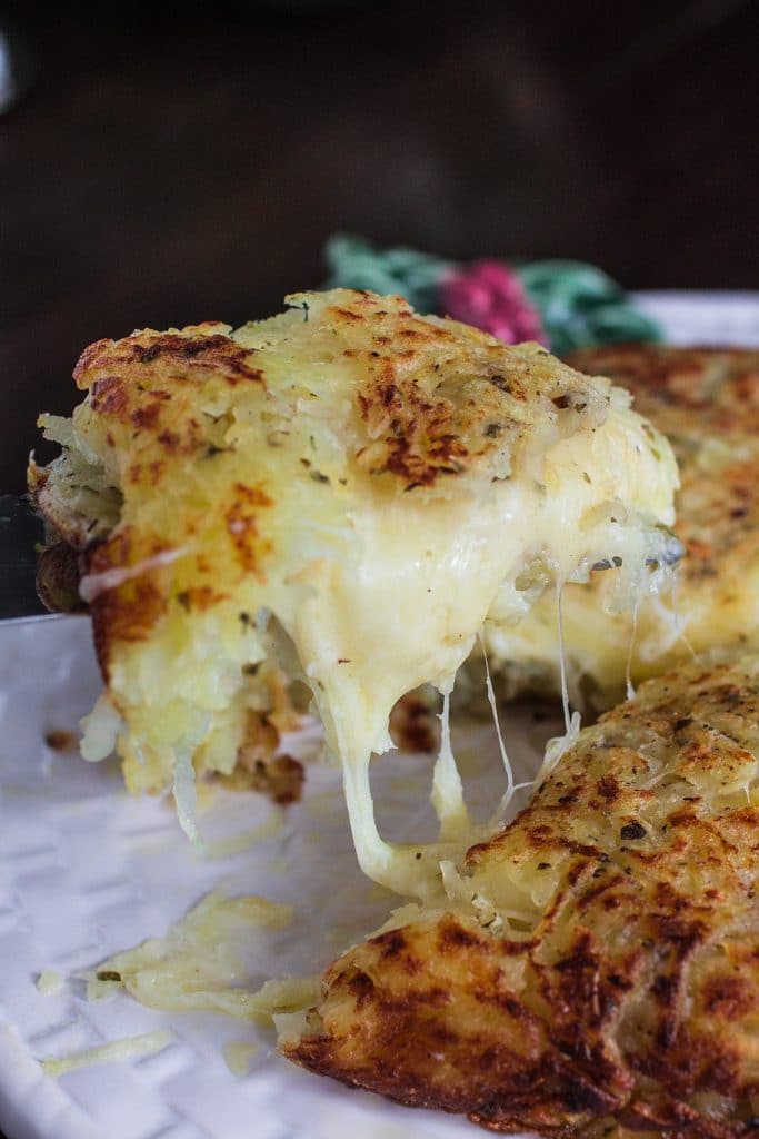 Three-Cheese Stuffed Rosti Potatoes | www.oliviascuisine.com | This delicious dish comes from Switzerland and consists of a potato cake, fried on both sides and stuffed with 3 different types of cheese. Perfect as a side dish for the holidays or as a main course whenever you are craving potatoes. #BeholdPotatoes #sponsored