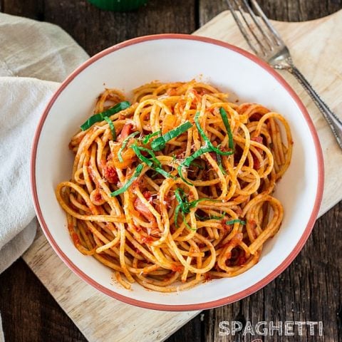 Spaghetti all' Amatriciana | www.oliviascuisine.com | A super easy yet delicious spicy pasta dish featuring diced pancetta, red pepper flakes, basil and Bertolli Riserva Marinara with Parmigiano-Reggiano. #sponsored