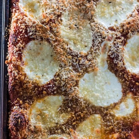 Sfincione (Sicilian Christmas Pizza) | www.oliviascuisine.com | This deep-dish pizza is topped with caramelized onions, breadcrumbs and caciocavallo. It is usually served for Christmas Eve or New Year's Eve in Sicily, but available all year long. #sponsored