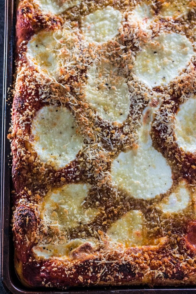 Sfincione (Sicilian Christmas Pizza) | www.oliviascuisine.com | This deep-dish pizza is topped with caramelized onions, breadcrumbs and caciocavallo. It is usually served for Christmas Eve or New Year's Eve in Sicily, but available all year long. #sponsored