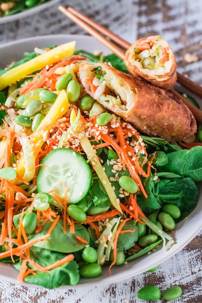 Asian Salad with Sesame Ginger Vinaigrette | www.oliviascuisine.com | Spinach and watercress tossed with carrots, crunchy broccoli stems, mango, cucumbers, edamame, crushed peanuts, sesame seeds and a delicious sesame ginger vinaigrette. Serve with Pagoda egg rolls to make it a meal! #FrozenFromScratch #ad