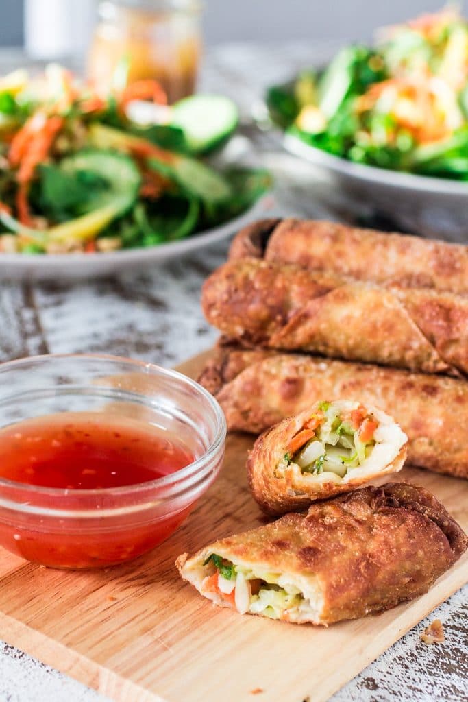 Asian Salad with Sesame Ginger Vinaigrette | www.oliviascuisine.com | Spinach and watercress tossed with carrots, crunchy broccoli stems, mango, cucumbers, edamame, crushed peanuts, sesame seeds and a delicious sesame ginger vinaigrette. Serve with Pagoda egg rolls to make it a meal! #FrozenFromScratch #ad