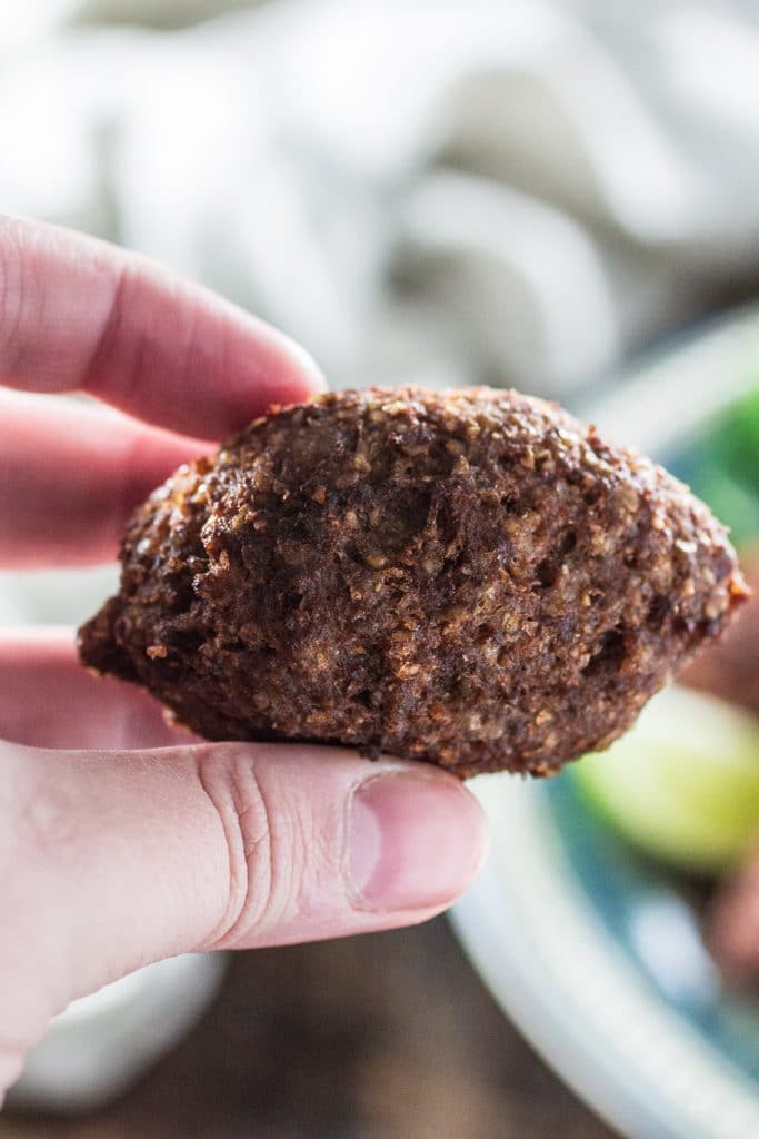 Kibbeh (Lebanese Beef Croquettes) | www.oliviascuisine.com | This Lebanese classic is one of my favorite dishes in the whole world! It consists of a dough made of meat, bulgur (cracked wheat), onions and mint leaves, formed into football shaped croquettes, and filled with more meat, onions, pine nuts and Middle Eastern spices. They are then deep fried to perfection so they are crisp on the outside and soft inside!