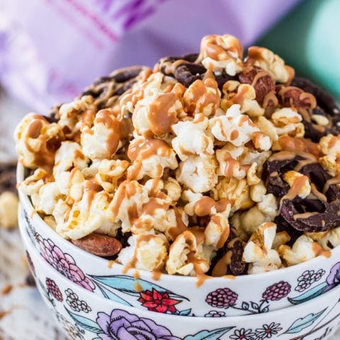 Popcorn Party Mix | www.oliviascuisine.com | Making a popcorn party mix couldn't be easier. Simply toss together some BOOMCHICKAPOP, chocolate covered pretzels and roasted almonds. Oh, and don't forget to drizzle everything with some melted peanut butter! :P #sponsored #BringtheBOOM