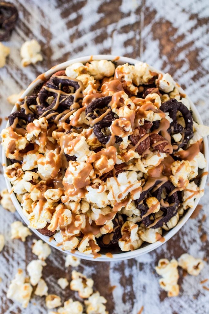 Popcorn Party Mix | www.oliviascuisine.com | Making a popcorn party mix couldn't be easier. Simply toss together some BOOMCHICKAPOP, chocolate covered pretzels and roasted almonds. Oh, and don't forget to drizzle everything with some melted peanut butter! :P #sponsored #BringtheBOOM