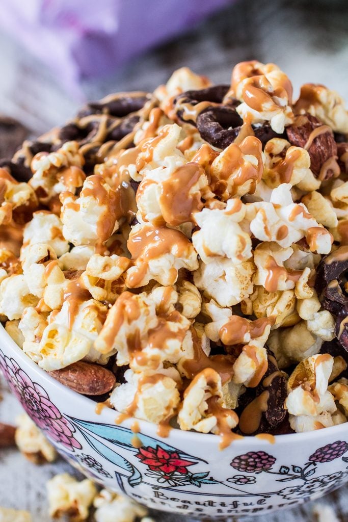 Popcorn Party Mix | www.oliviascuisine.com | Making a popcorn party mix couldn't be easier. Simply toss together some BOOMCHICKAPOP, chocolate covered pretzels and roasted almonds. Oh, and don't forget to drizzle everything with some melted peanut butter! :P #sponsored #BringtheBOOM