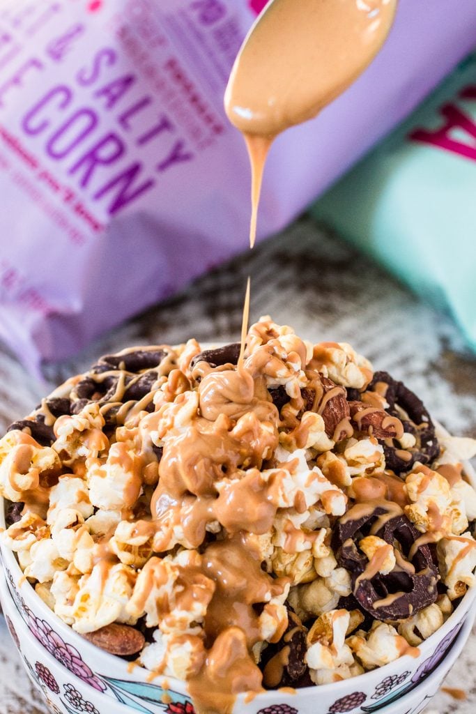 Popcorn Party Mix | www.oliviascuisine.com | Making a popcorn party mix couldn't be easier. Simply toss together some BOOMCHICKAPOP, chocolate covered pretzels and roasted almonds. Oh, and don't forget to drizzle everything with some melted peanut butter! :P #sponsored #BringtheBOOM