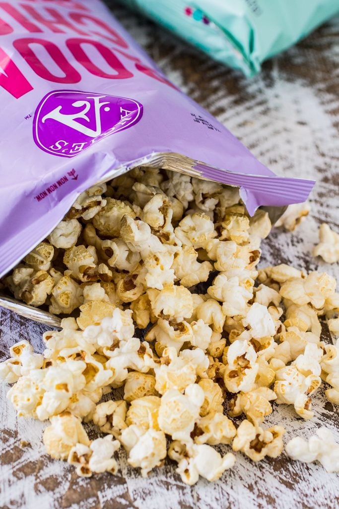 Popcorn Party Mix | www.oliviascuisine.com | Making a popcorn party mix couldn't be easier. Simply toss together some BOOMCHICKAPOP, chocolate covered pretzels and roasted almonds. Oh, and don't forget to drizzle everything with some melted peanut butter! :P #sponsored #BringtheBOOM