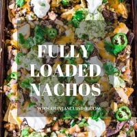 Fully Loaded Nachos | www.oliviascuisine.com | 9 layers of perfection: 3 different kinds of tortilla chips, Chipotle Beer Shredded Beef, Black Beans, the most incredible cheese sauce, more cheese, pico de gallo salsa, jalapeños, guacamole and sour cream or mexican crema!