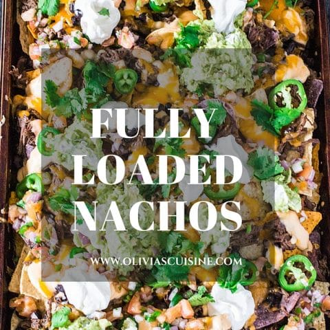 Fully Loaded Nachos | www.oliviascuisine.com | 9 layers of perfection: 3 different kinds of tortilla chips, Chipotle Beer Shredded Beef, Black Beans, the most incredible cheese sauce, more cheese, pico de gallo salsa, jalapeños, guacamole and sour cream or mexican crema!