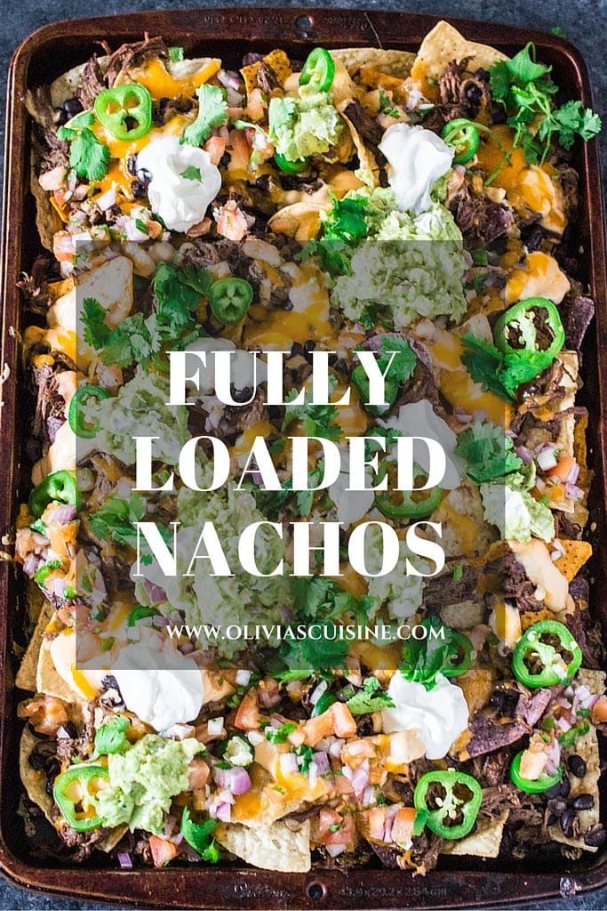Fully Loaded Nachos | www.oliviascuisine.com | 9 layers of perfection: 3 different kinds of tortilla chips, Chipotle Beer Shredded Beef, Black Beans, the most incredible cheese sauce, more cheese, pico de gallo salsa, jalapeños, guacamole and sour cream or mexican crema! 