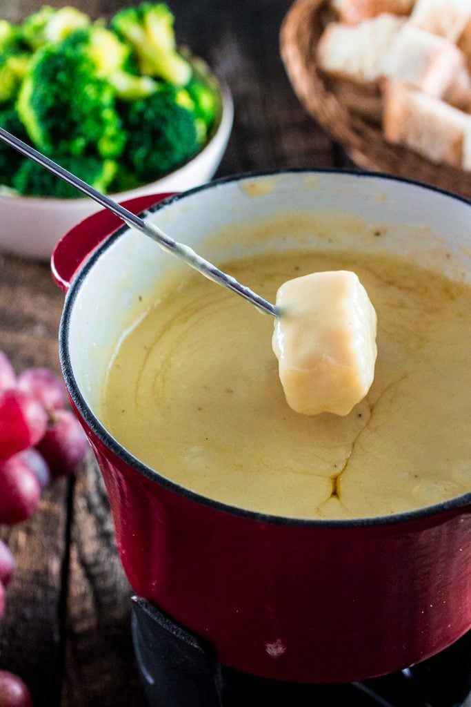 Swiss Cheese Fondue | www.oliviascuisine.com | Take date night to a whole new level with this classic Swiss Cheese Fondue. Because nothing says romance like sharing a pot of melted cheese!