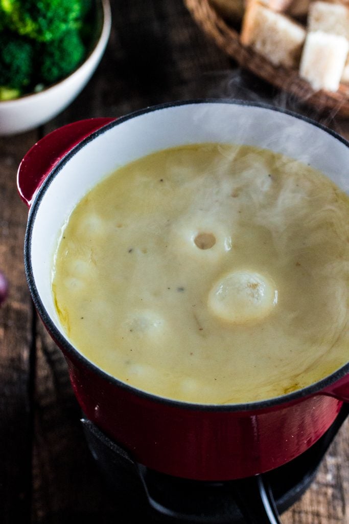 Swiss Cheese Fondue | www.oliviascuisine.com | Take date night to a whole new level with this classic Swiss Cheese Fondue. Because nothing says romance like sharing a pot of melted cheese!