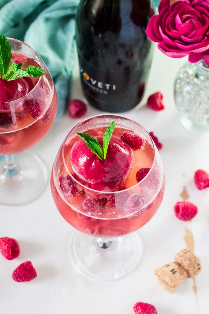 Raspberry Sorbet Bellini | www.oliviascuisine.com | A fun twist on the classic Bellini, made with raspberry sorbet and prosecco. Perfect for Spring and Summer! #VOVETI #CleverGirls