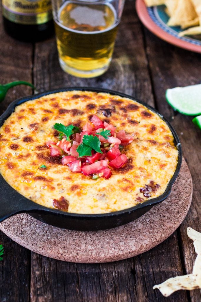 Mexican Queso Fundido with Chorizo | www.oliviascuisine.com | Celebrate Cinco de Mayo with this cheesy and delicious appetizer. You can omit the chorizo for a vegetarian version!