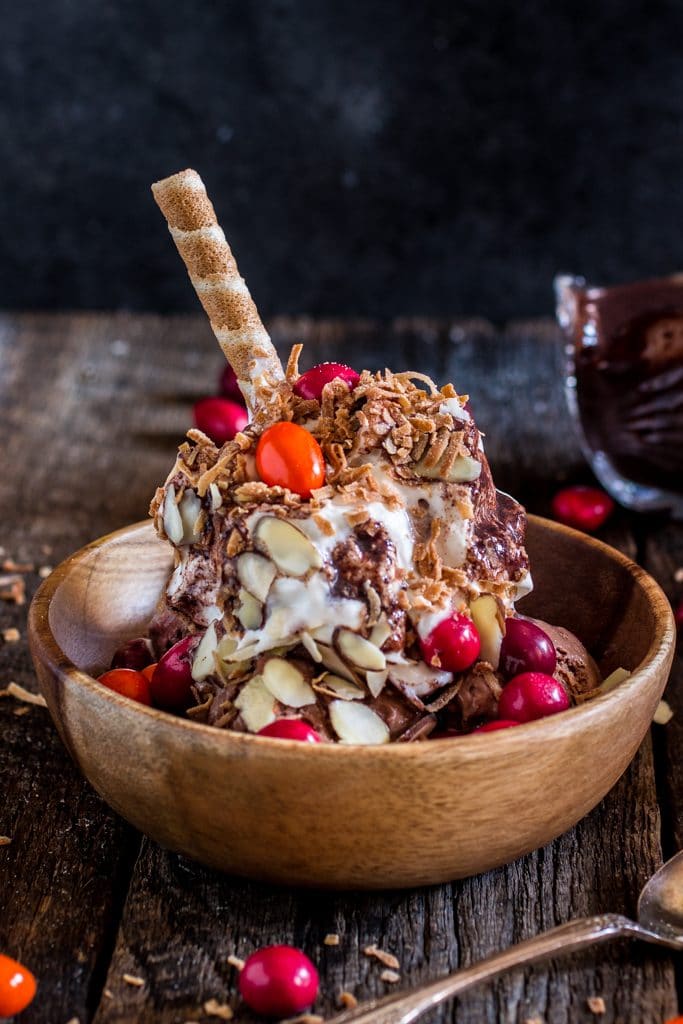 Mexican Hot Fudge Sundae | www.oliviascuisine.com | Chocolate ice cream topped with a delicious spiced hot fudge, whipped cream, toasted coconut flakes, almonds and M&M’s® Chili Nut! #MMSFlavorVote #Walmart #ad