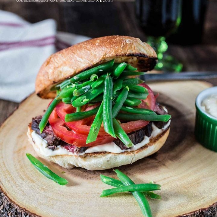 Chacarero (Chilean Steak Sandwich) | www.oliviascuisine.com | This is Chile's national sandwich. It consists of a roll piled high with grilled meat, tomatoes, a dollop of mayo, hot sauce and green beans! (Food styling and photography by Olivia Mesquita.)