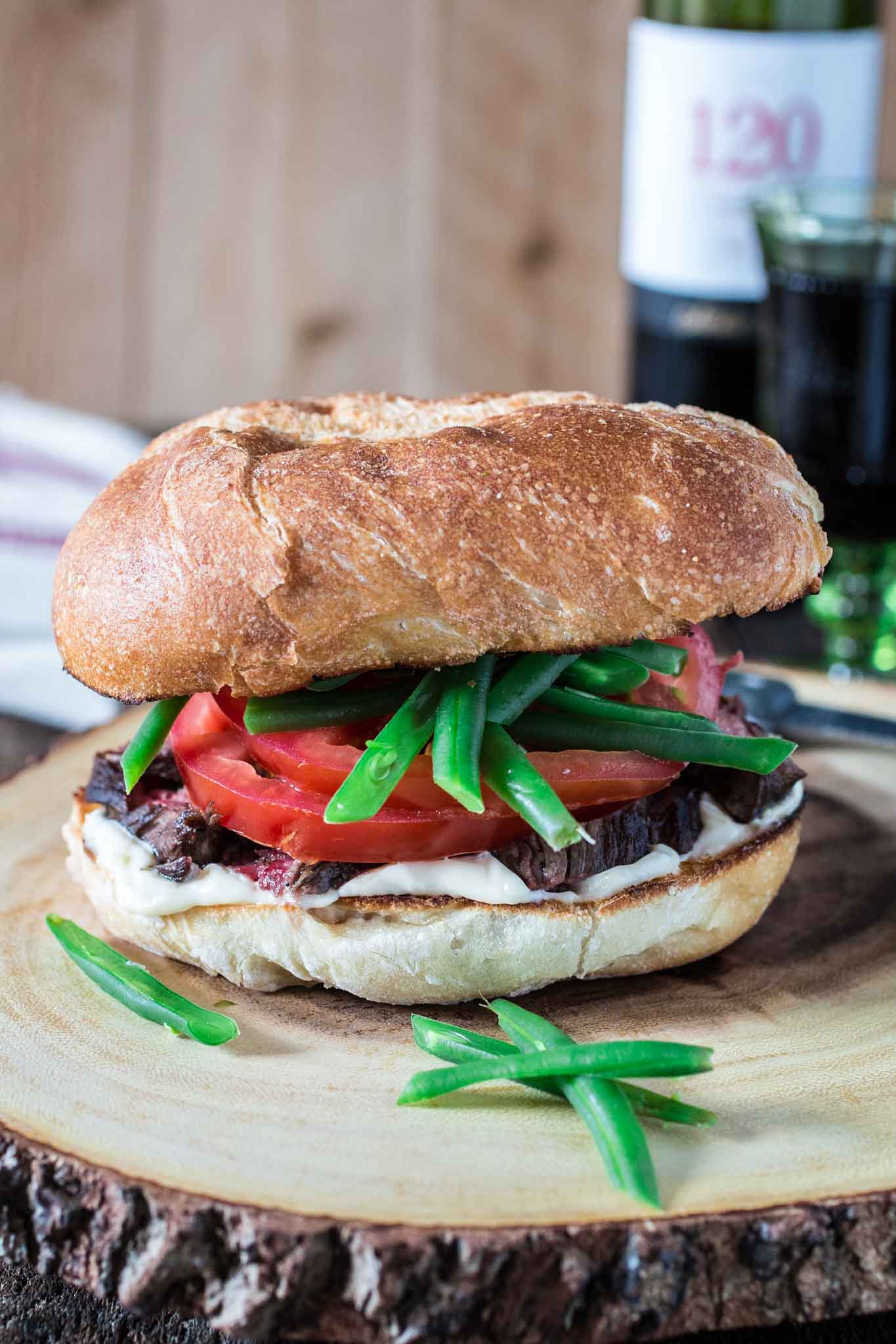 Chacarero (Chilean Steak Sandwich) | www.oliviascuisine.com | This is Chile's national sandwich. It consists of a roll piled high with grilled meat, tomatoes, a dollop of mayo, hot sauce and green beans! (Food styling and photography by Olivia Mesquita.)
