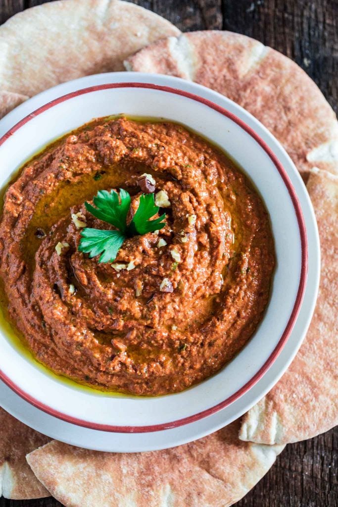 Muhammara (Red Pepper and Walnut Dip) | www.oliviascuisine.com | A middle eastern spread made with roasted red peppers, toasted walnuts, scallions, spices, breadcrumbs, olive oil and pomegranate molasses. It's a delicious sweet and spicy dip and a great alternative to hummus! (In partnership with Mezzetta.)