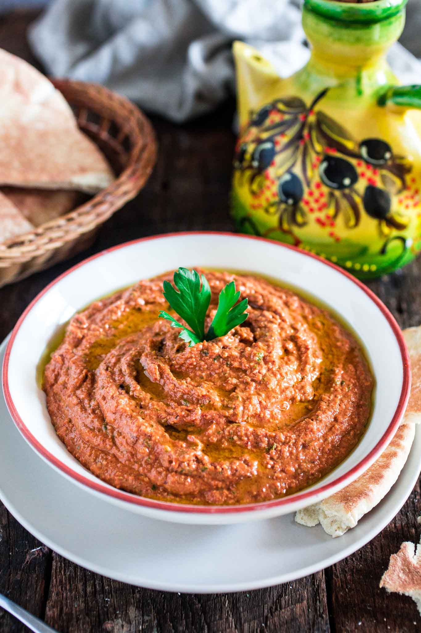 Muhammara (Red Pepper and Walnut Dip) | www.oliviascuisine.com | A middle eastern spread made with roasted red peppers, toasted walnuts, scallions, spices, breadcrumbs, olive oil and pomegranate molasses. It's a delicious sweet and spicy dip and a great alternative to hummus! (In partnership with Mezzetta.)