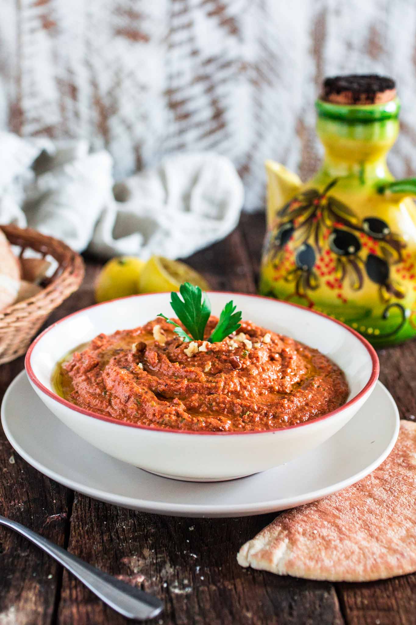 Muhammara (Red Pepper and Walnut Dip) | www.oliviascuisine.com | A middle eastern spread made with roasted red peppers, toasted walnuts, scallions, spices, breadcrumbs, olive oil and pomegranate molasses. It's a delicious sweet and spicy dip and a great alternative to hummus! (In partnership with Mezzetta.)