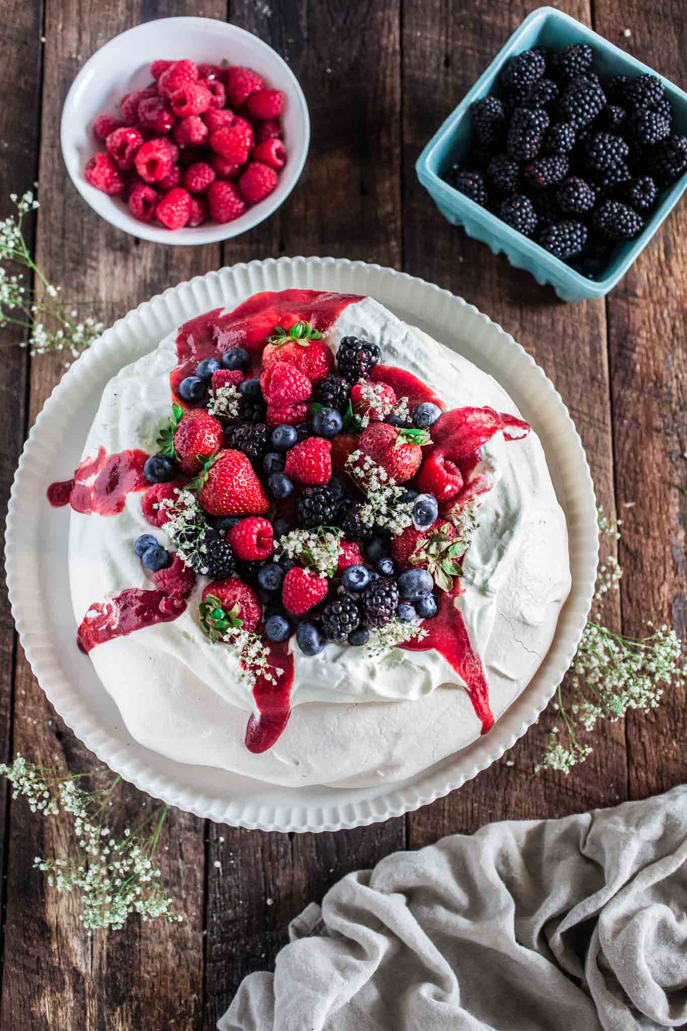 Berry Pavlova | www.oliviascuisine.com | A delicious meringue-based dessert named after the Russian ballerina Anna Pavlova. Easy to make and always a crowd pleaser!