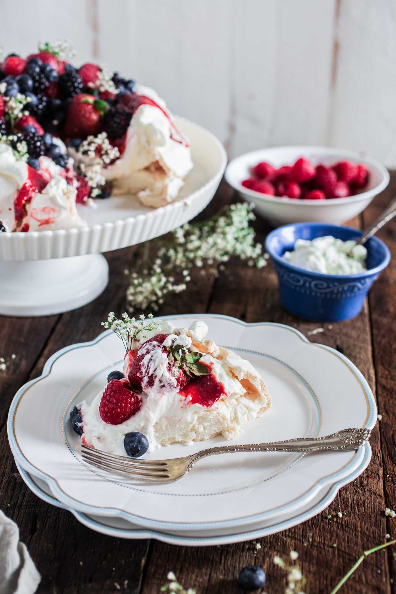 Berry Pavlova | www.oliviascuisine.com | A delicious meringue-based dessert named after the Russian ballerina Anna Pavlova. Easy to make and always a crowd pleaser!