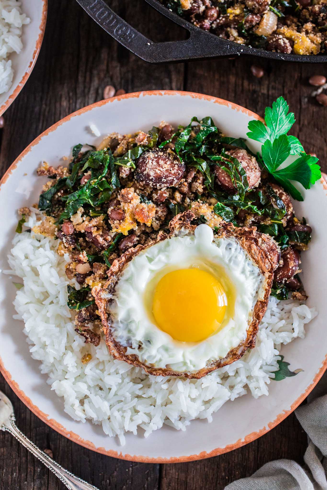 Feijão Tropeiro (Brazilian Beans with Sausage and Collard Greens) | www.oliviascuisine.com | If you like Brazilian food, this one is for you: Feijão Tropeiro. A traditional dish from Minas Gerais, made with beans, bacon, sausage, collard greens, eggs and manioc flour. 