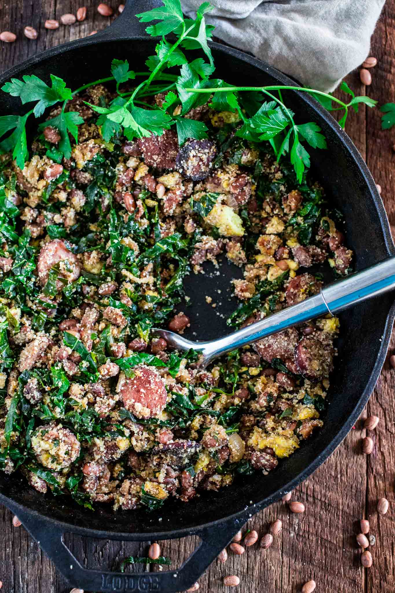 Feijão Tropeiro (Brazilian Beans with Sausage and Collard Greens) | www.oliviascuisine.com | If you like Brazilian food, this one is for you: Feijão Tropeiro. A traditional dish from Minas Gerais, made with beans, bacon, sausage, collard greens, eggs and manioc flour. 