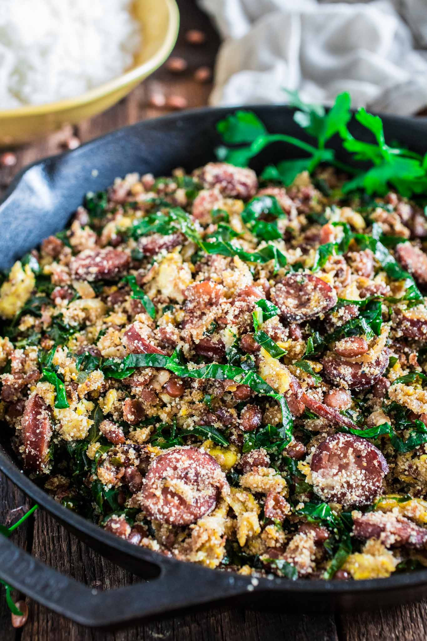 Feijão Tropeiro (Brazilian Beans with Sausage and Collard Greens) | www.oliviascuisine.com | If you like Brazilian food, this one is for you: Feijão Tropeiro. A traditional dish from Minas Gerais, made with beans, bacon, sausage, collard greens, eggs and manioc flour. 