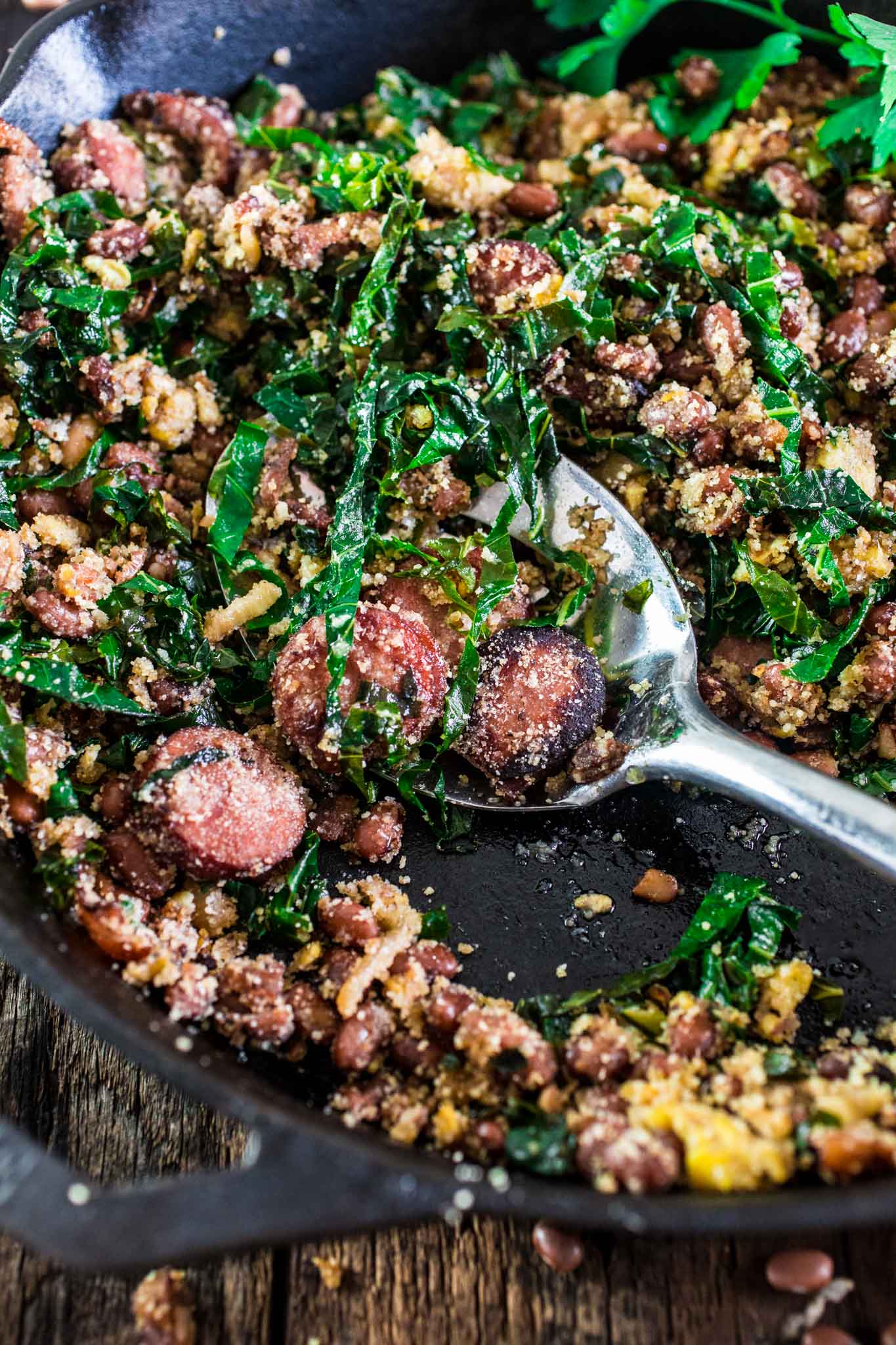 Feijão Tropeiro (Brazilian Beans with Sausage and Collard Greens) | www.oliviascuisine.com | If you like Brazilian food, this one is for you: Feijão Tropeiro. A traditional dish from Minas Gerais, made with beans, bacon, sausage, collard greens, eggs and manioc flour. 