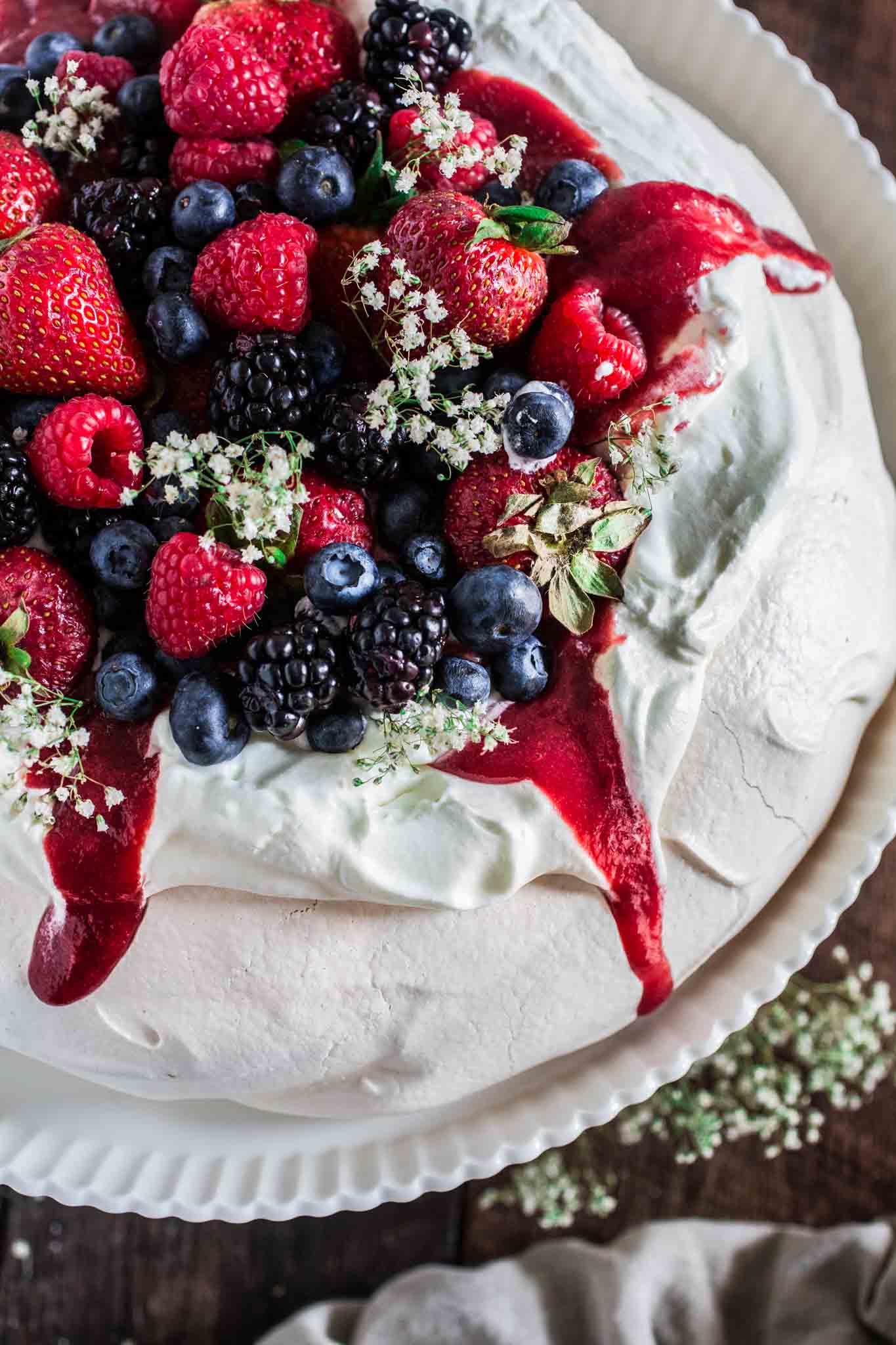 Berry Pavlova | www.oliviascuisine.com | A delicious meringue-based dessert named after the Russian ballerina Anna Pavlova. Easy to make and always a crowd pleaser!