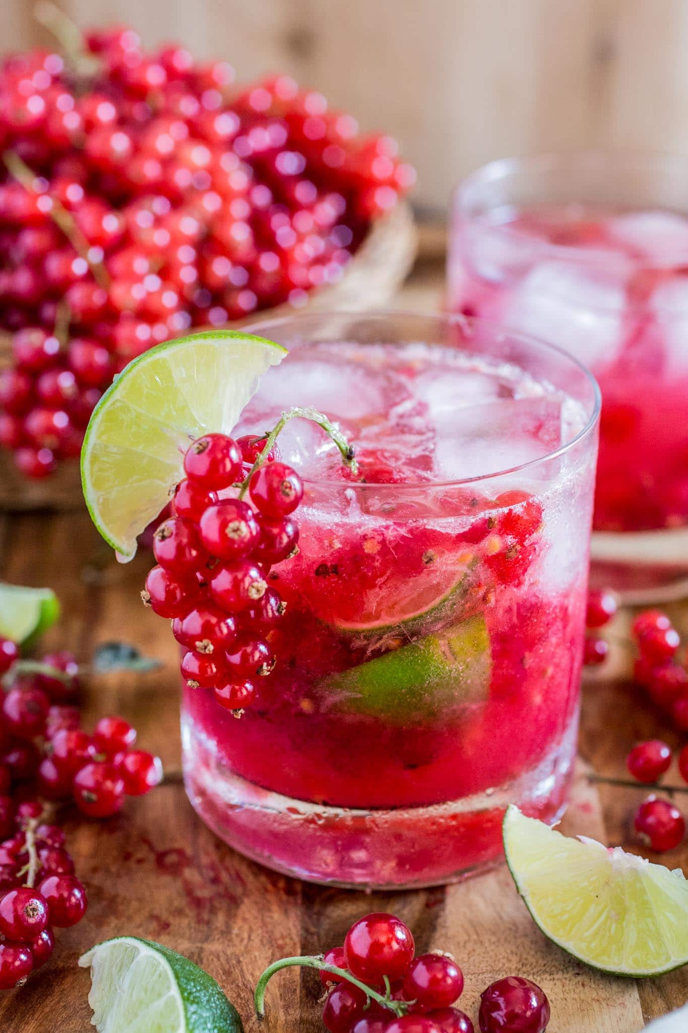 Red Currant Caipirinha | www.oliviascuisine.com | This red currant twist on a classic lime Caipirinha might be my new favorite summertime cocktail! Sour, sweet and as strong as you can take it. There's really no better way to beat the heat! (Sponsored by HBF International.)