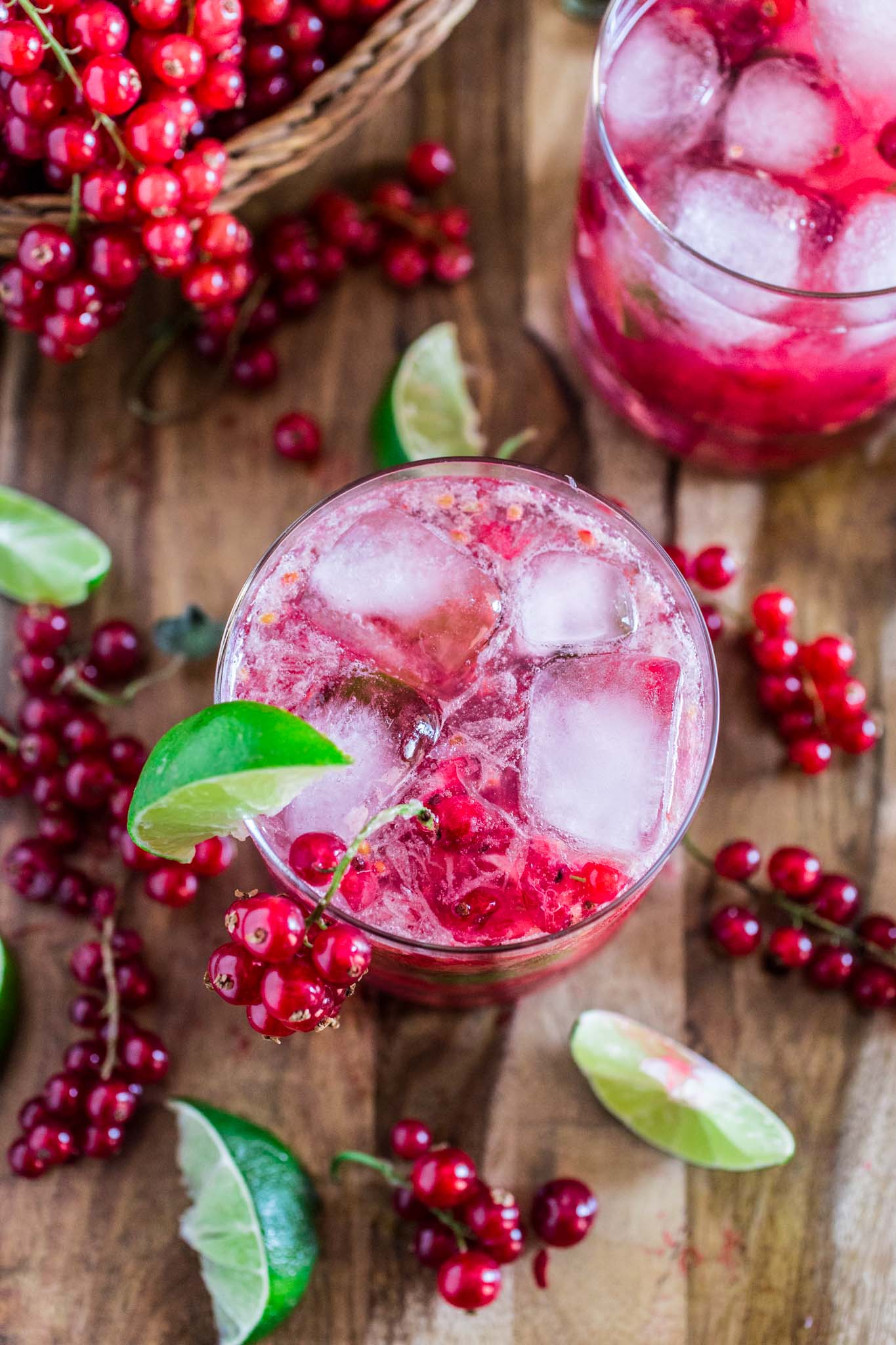 Red Currant Caipirinha | www.oliviascuisine.com | This red currant twist on a classic lime Caipirinha might be my new favorite summertime cocktail! Sour, sweet and as strong as you can take it. There's really no better way to beat the heat! (Sponsored by HBF International.)