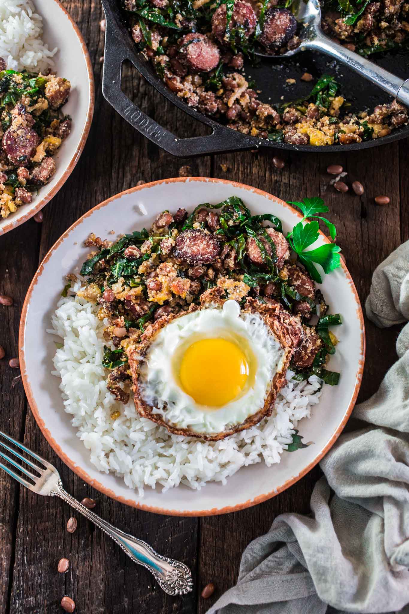 Feijão Tropeiro (Brazilian Beans with Sausage and Collard Greens) | www.oliviascuisine.com | If you like Brazilian food, this one is for you: Feijão Tropeiro. A traditional dish from Minas Gerais, made with beans, bacon, sausage, collard greens, eggs and manioc flour. 