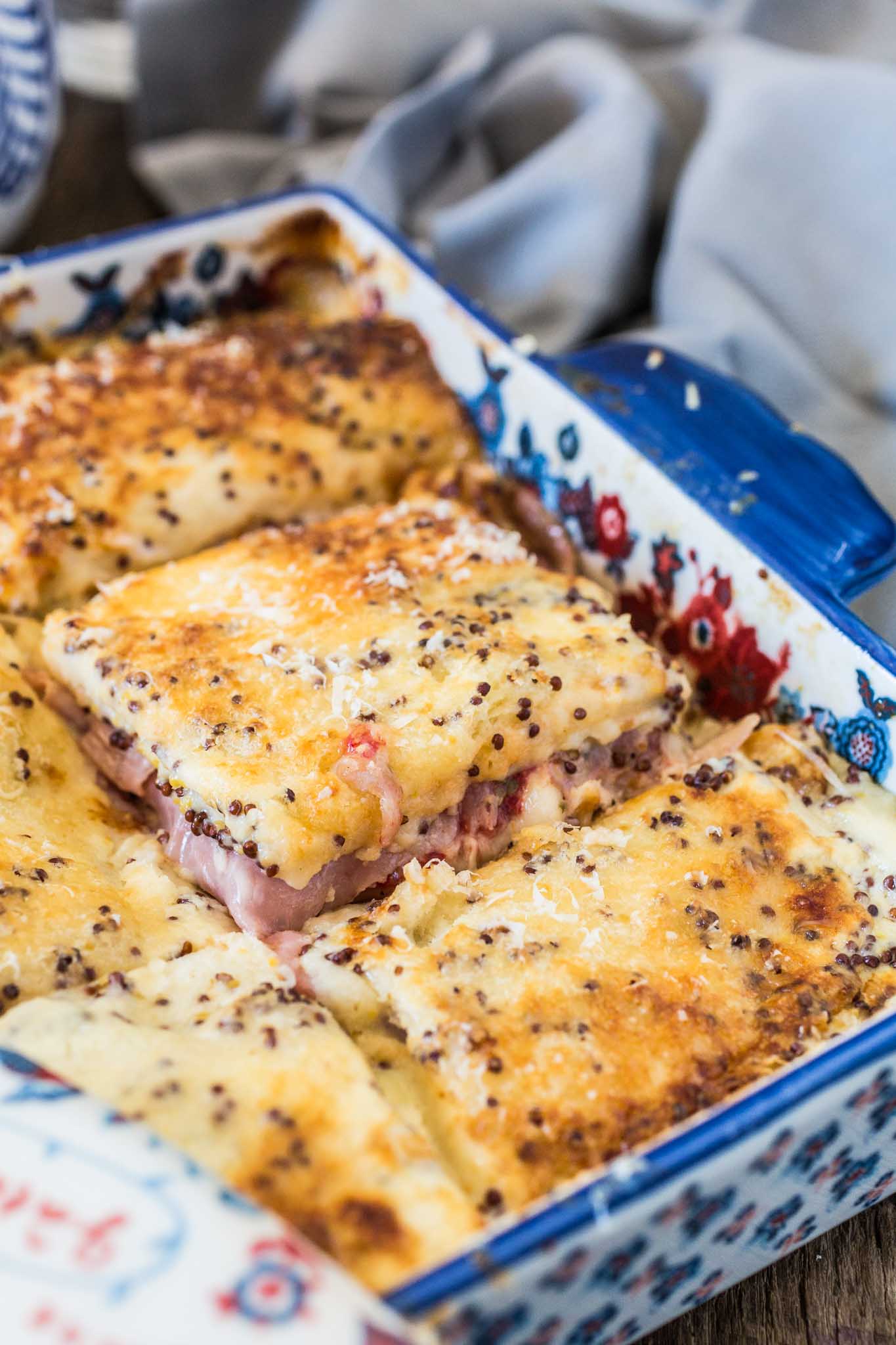 Brazilian Baked Ham and Cheese Sandwich | www.oliviascuisine.com | Who can resist a bubbly Baked Ham and Cheese Sandwich coming hot out of the oven? This Brazilian version takes it up a notch, because the sandwiches are covered with a delicious and creamy mustard-y white sauce. Simply to die for!