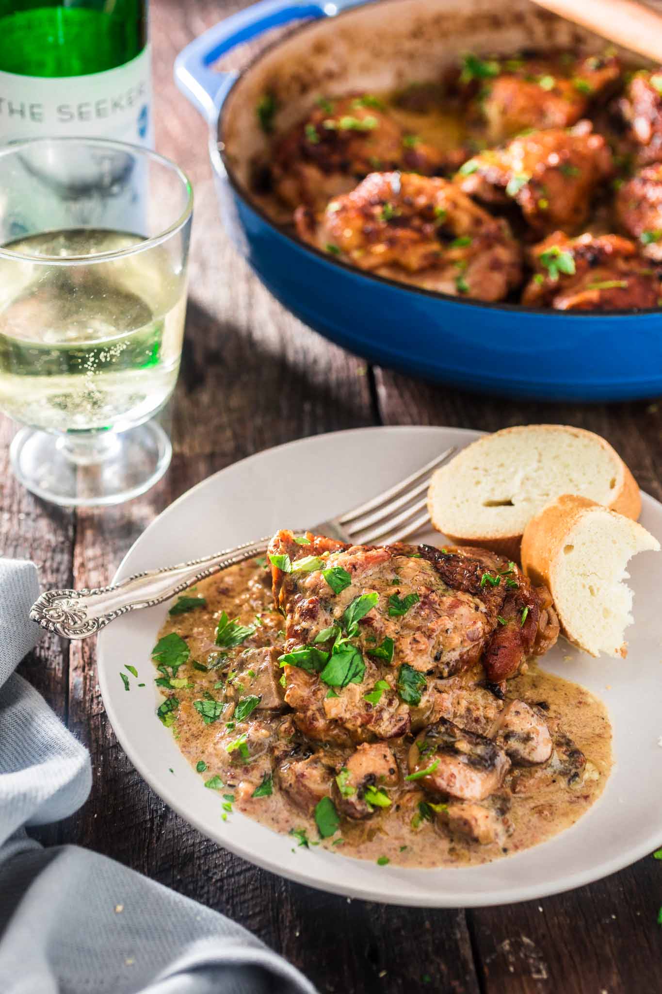 Coq au Riesling (Chicken Thighs Braised in White Wine) | www.oliviascuisine.com | A creamy twist on the classic Coq au Vin. Chicken thighs, bacon and mushrooms are braised in an off-dry Riesling and heavy cream is added at the end to make it even more delicious! Oh, and it's all made in one pot! (Sponsored by @theseekerwines)