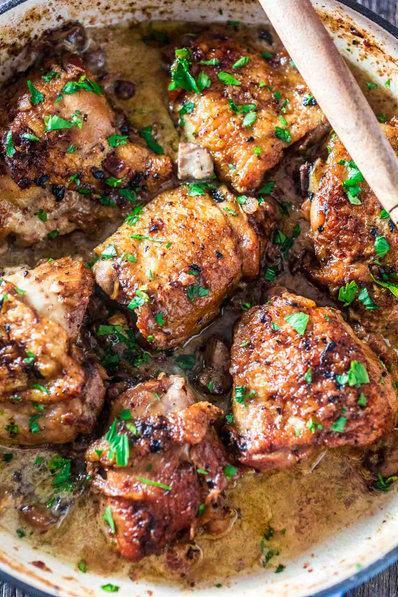 Coq au Riesling (Chicken Thighs Braised in White Wine) | www.oliviascuisine.com | A creamy twist on the classic Coq au Vin. Chicken thighs, bacon and mushrooms are braised in an off-dry Riesling and heavy cream is added at the end to make it even more delicious! Oh, and it's all made in one pot! (Sponsored by @theseekerwines)