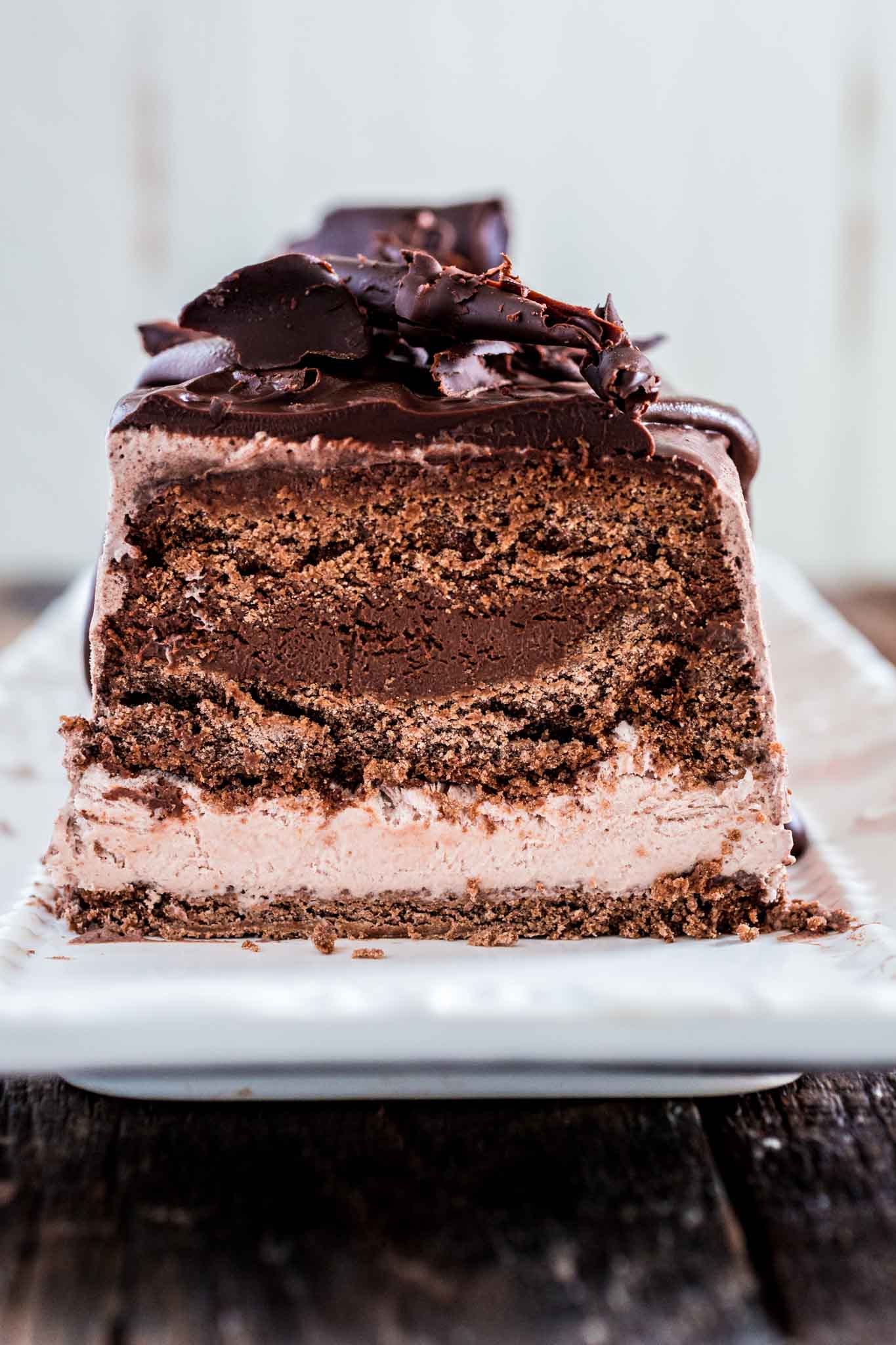 Chocolate Ice Cream Cake | www.oliviascuisine.com | This make-ahead chocolate ice cream cake has everything a chocoholic desires: chocolate cake, chocolate mousse and chocolate ice cream. It is a delightful dessert to celebrate a birthday or end a fabulous dinner party! (Sponsored by @CuriousCreamery) #CuriousCreamery #ad