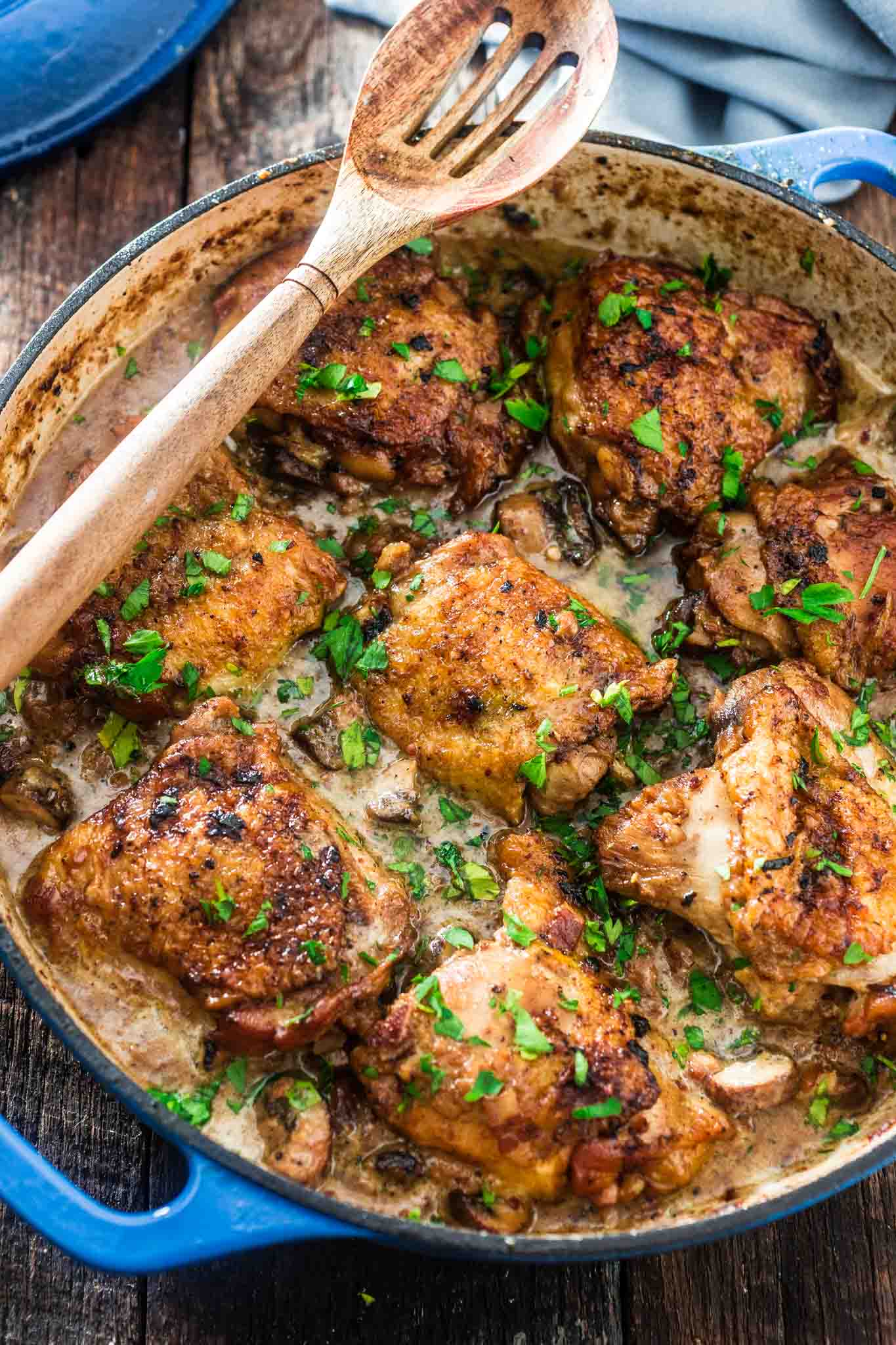 Coq au Riesling (Chicken Thighs Braised in White Wine) | www.oliviascuisine.com | A creamy twist on the classic Coq au Vin. Chicken thighs, bacon and mushrooms are braised in an off-dry Riesling and heavy cream is added at the end to make it even more delicious! Oh, and it's all made in one pot! (Sponsored by @theseekerwines)