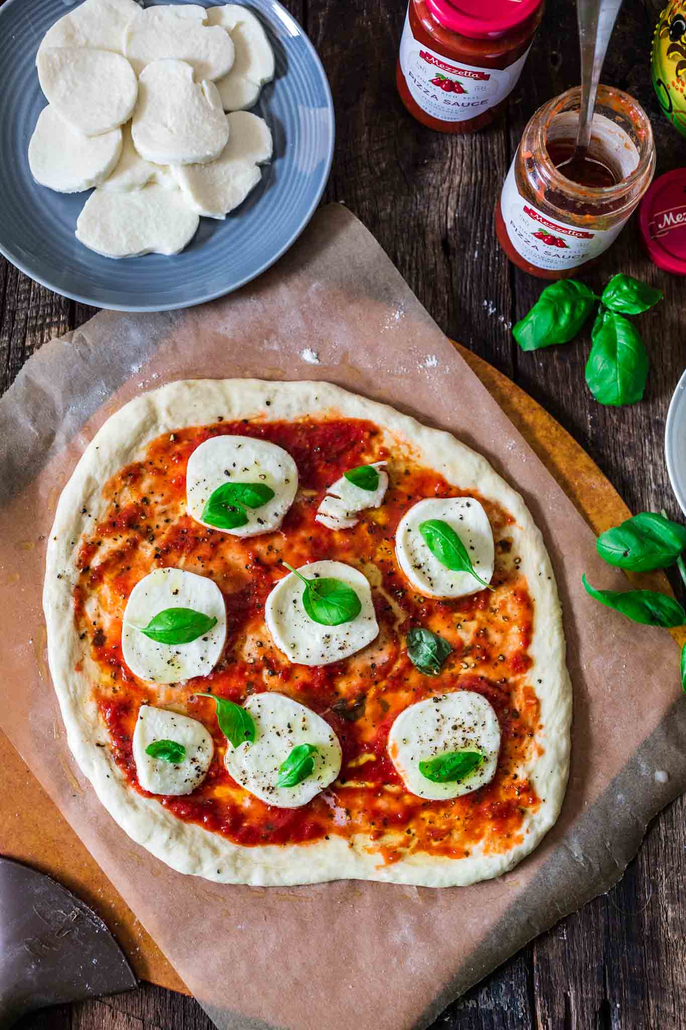 Classic Pizza Margherita | www.oliviascuisine.com | This delicious Margherita pizza is proof that some of the best things in life are the simplest. Only a few fresh ingredients create this iconic pizza from Naples. (In partnership with @Mezzetta.)
